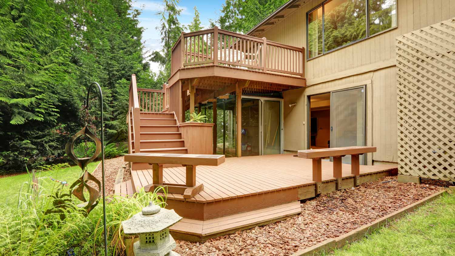 Wooden walkout deck with patio