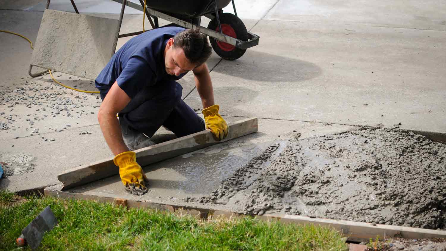 man cementing patio