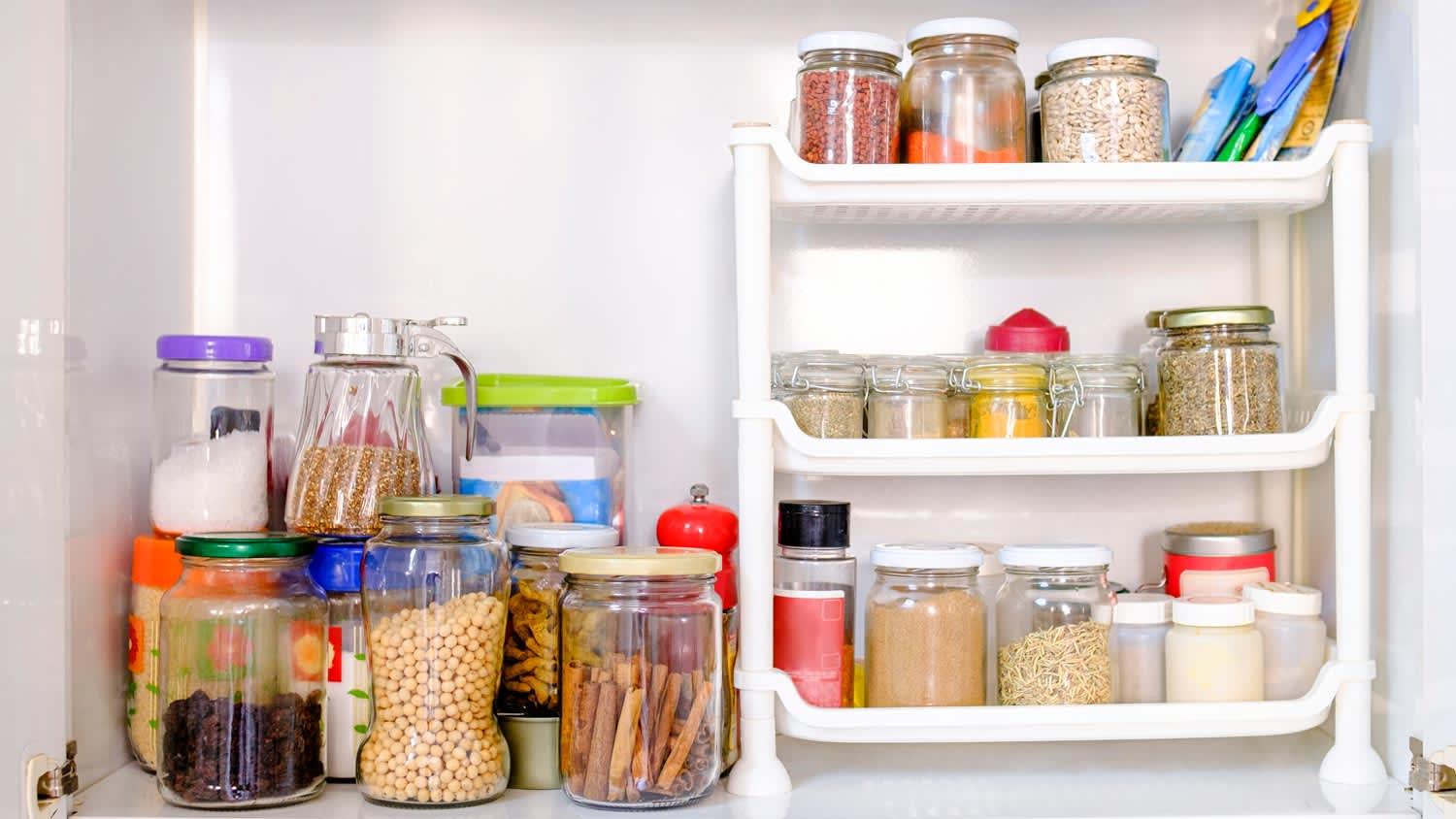 A well stocked pantry with cans and pots