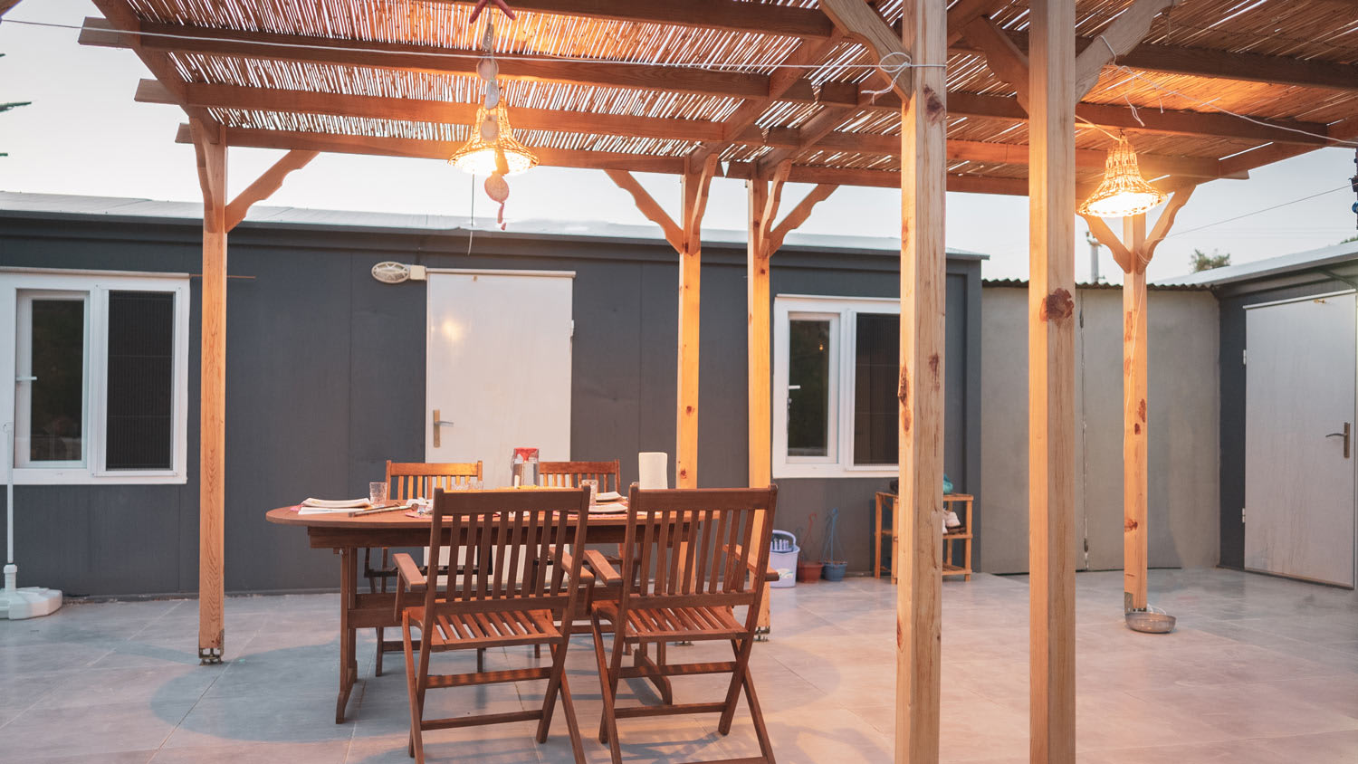 Pergola covering patio furniture in the backyard