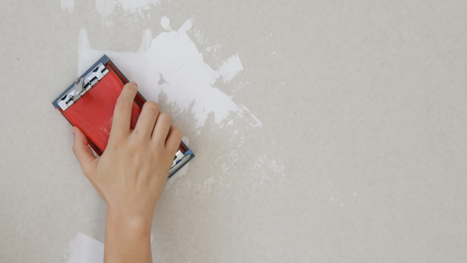 sanding wall with block