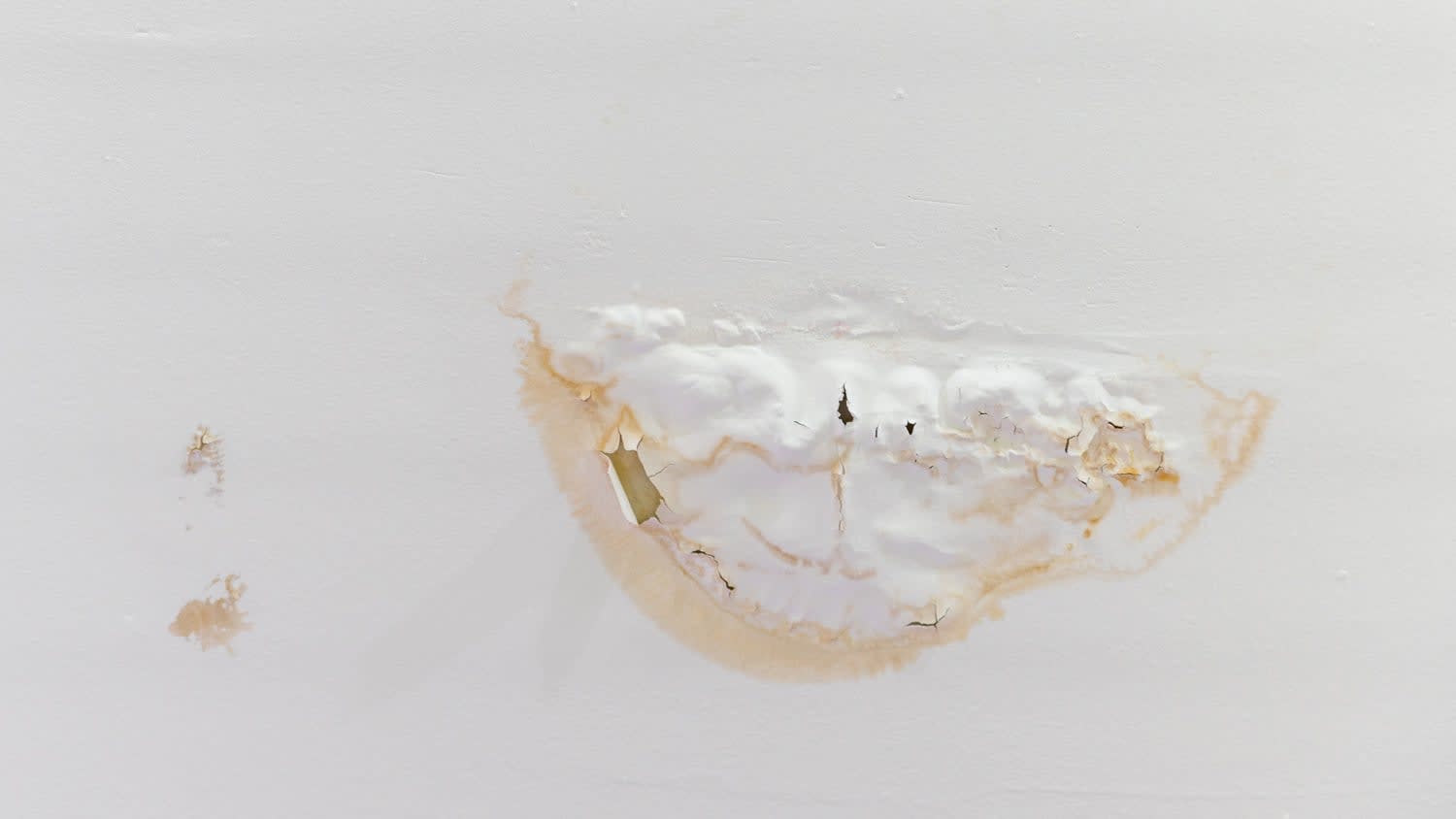 Bubbling paint showing signs of a leaky ceiling