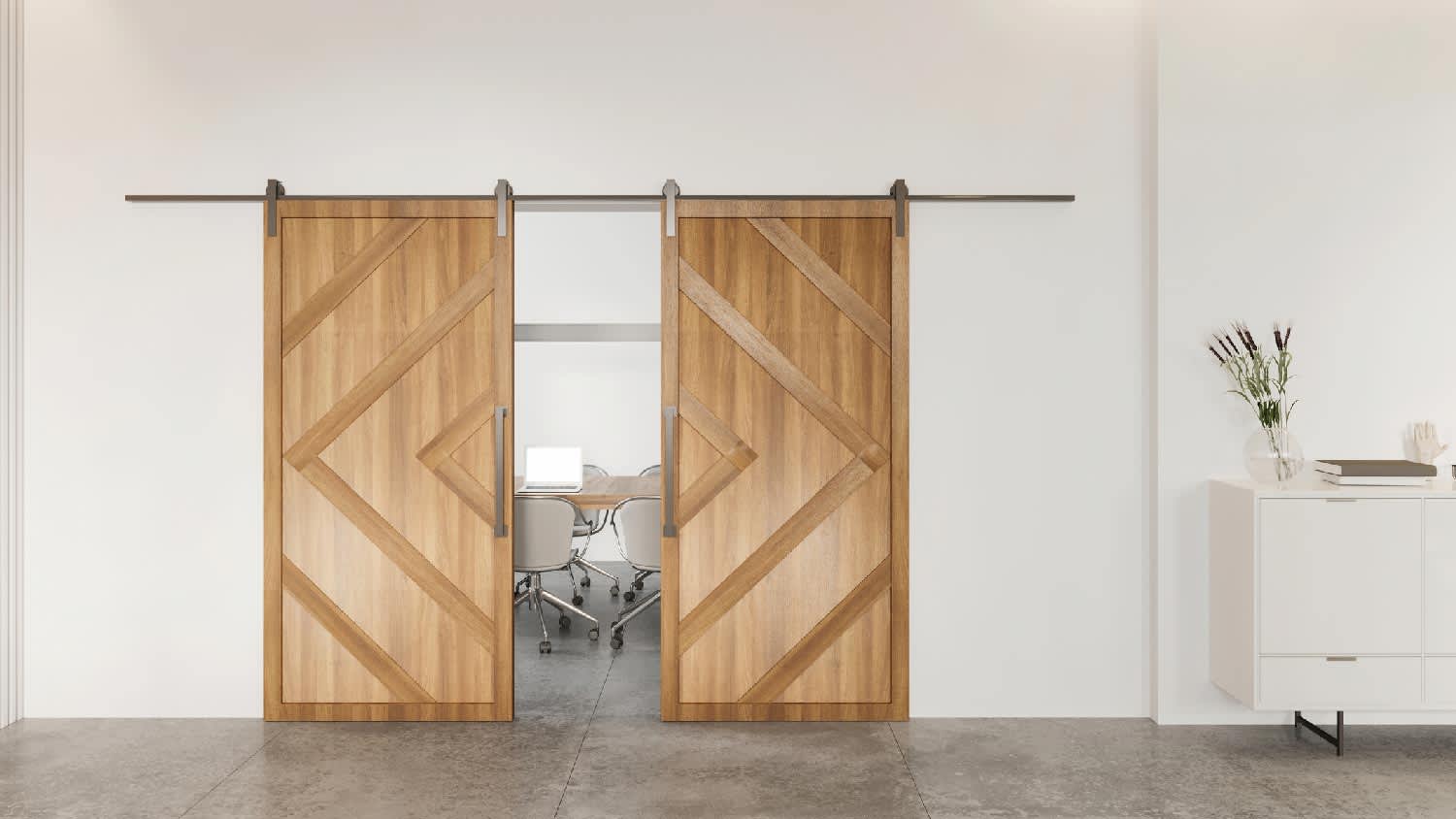 A 2-panel sliding barn door leading to a home office