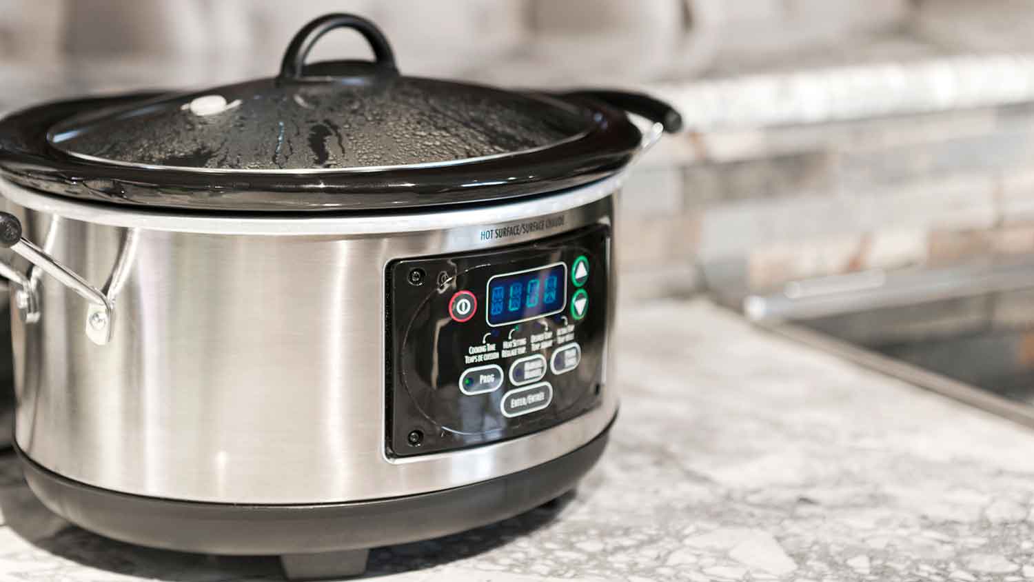Electric crockpot on a kitchen countertop