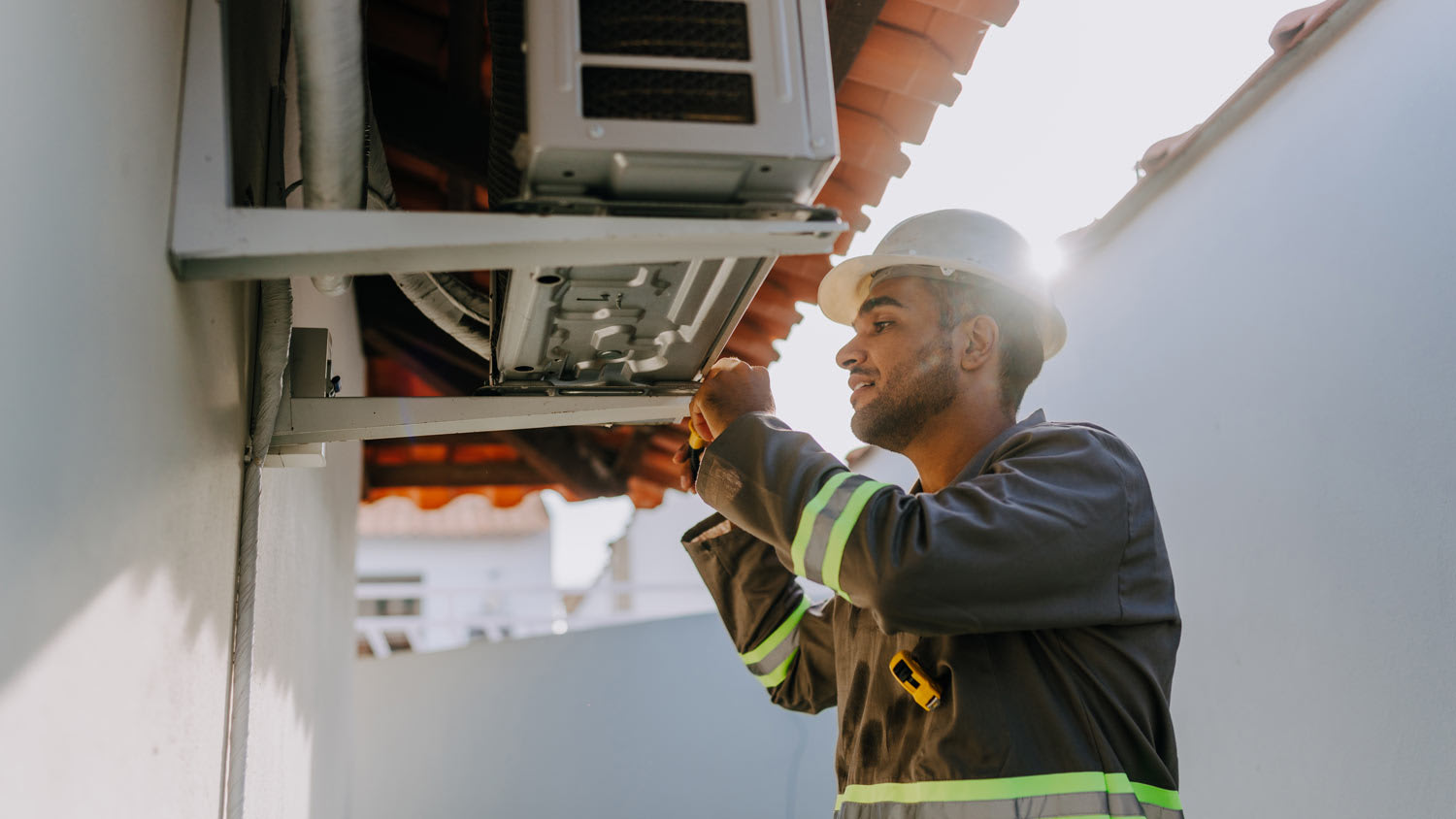 technician checking ac unit