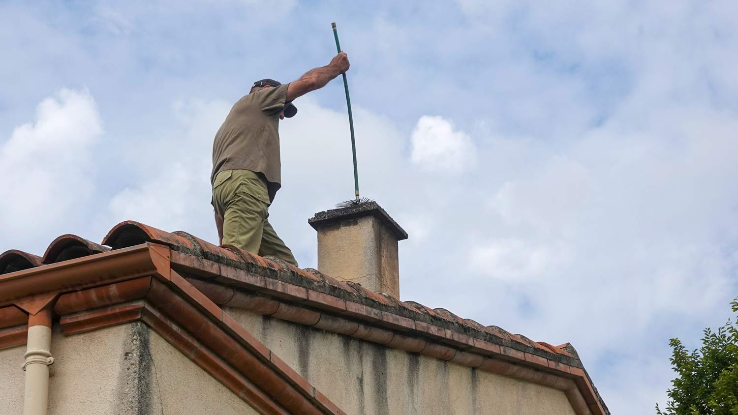 Man cleaning out chimney