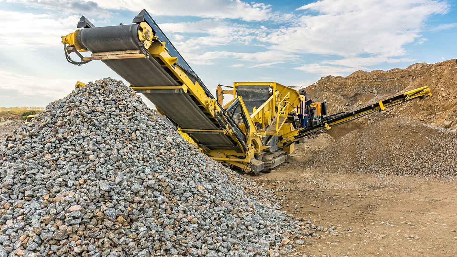 Stone crusher machine in the process of crushing stone
