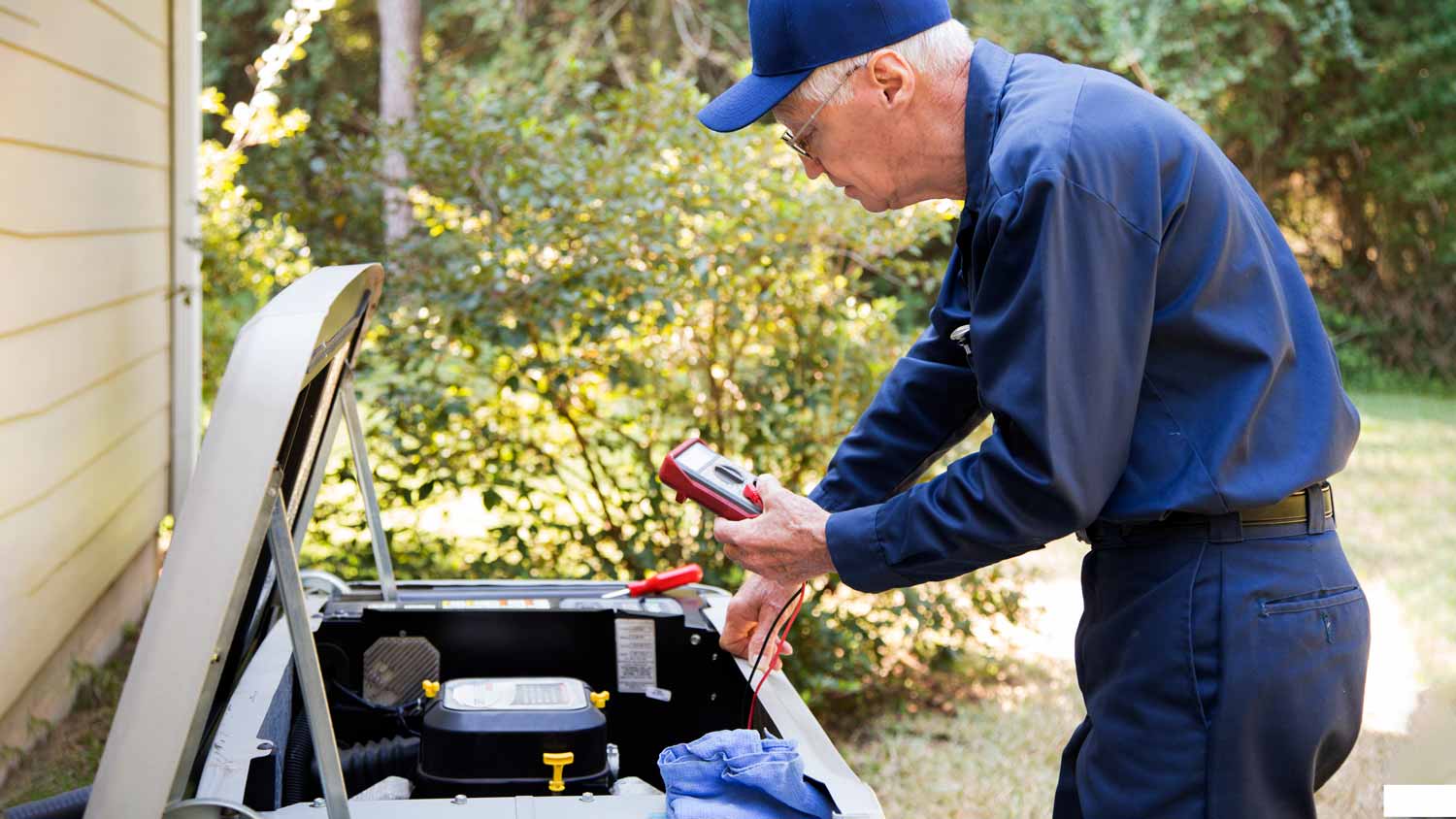 technician servicing gas generator