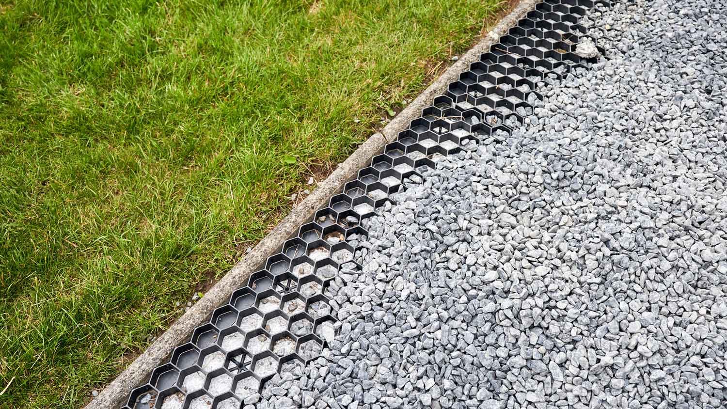 Permeable paver and gravel driveway installation