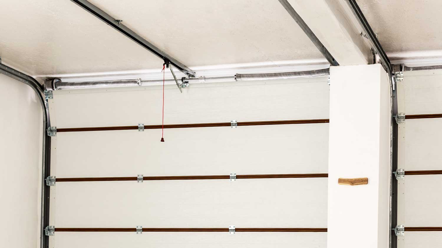 Standard torsion springs installed on the garage doors