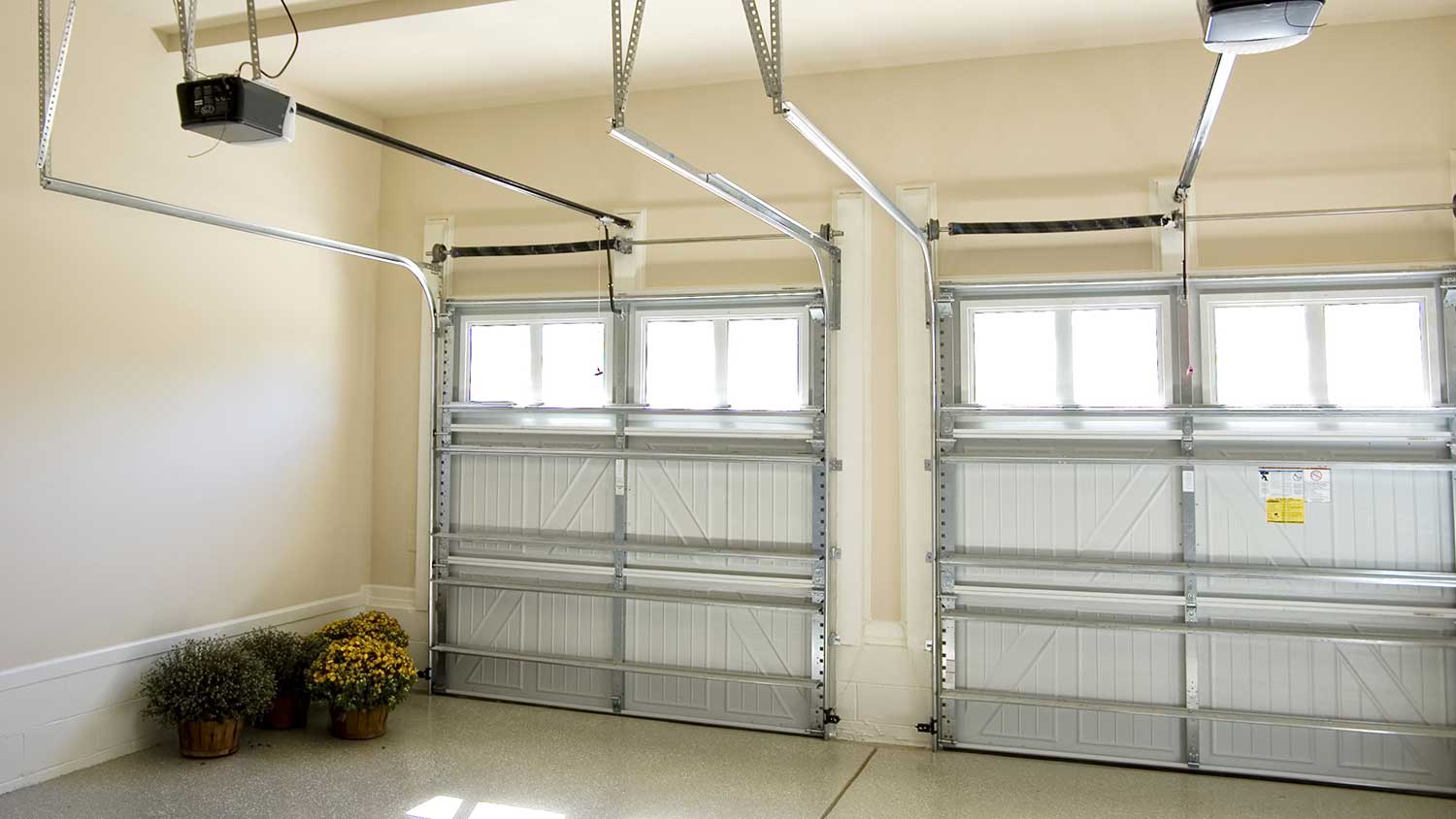 Residential garage interior with two automatic doors
