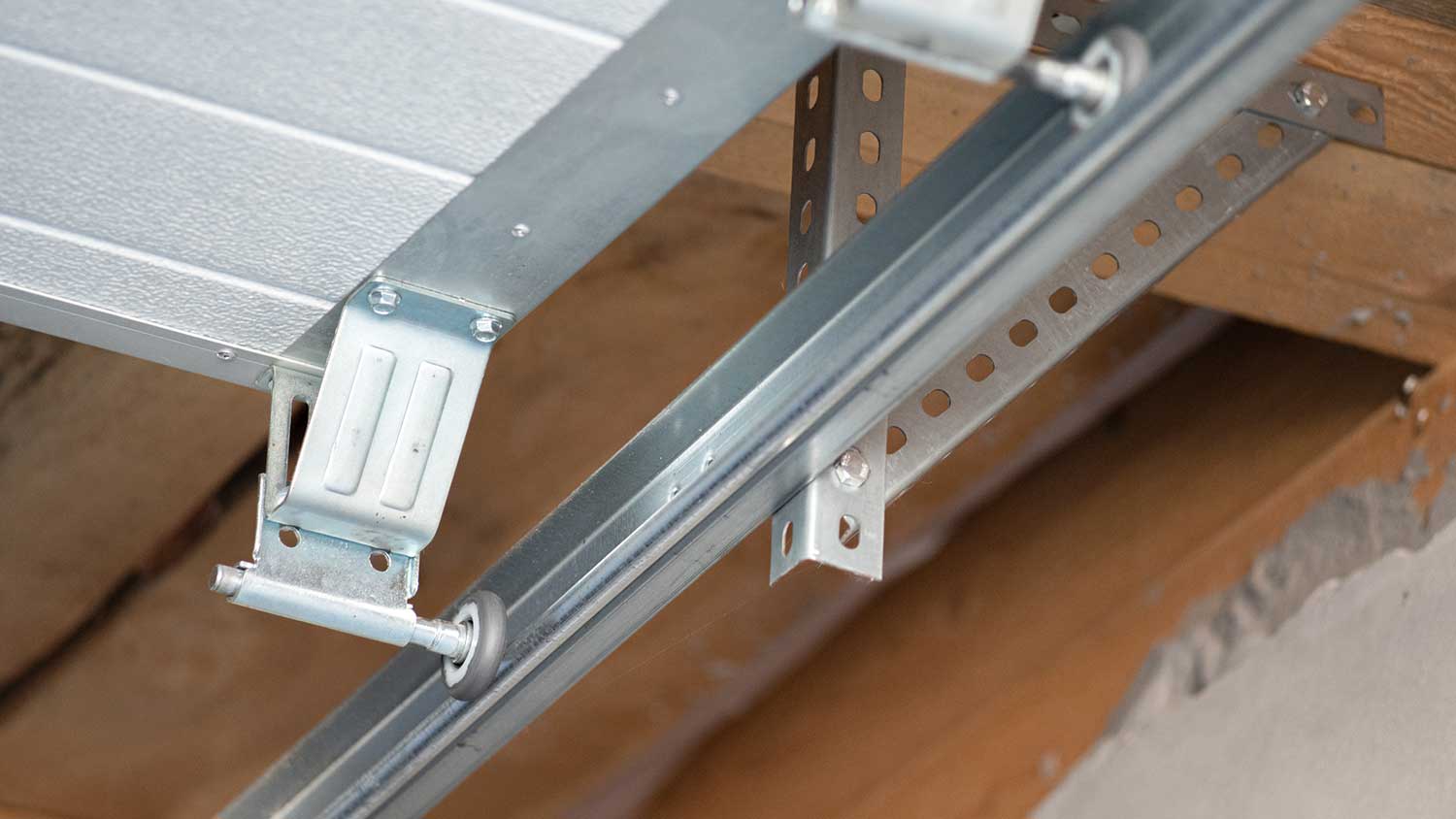 Automatic garage door rollers sitting in the door tracks