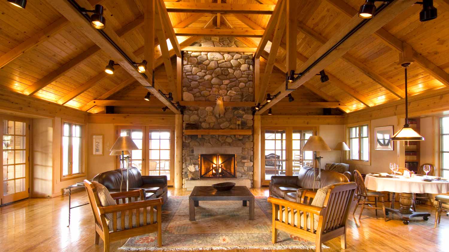 Living room and stone fireplace in cabin