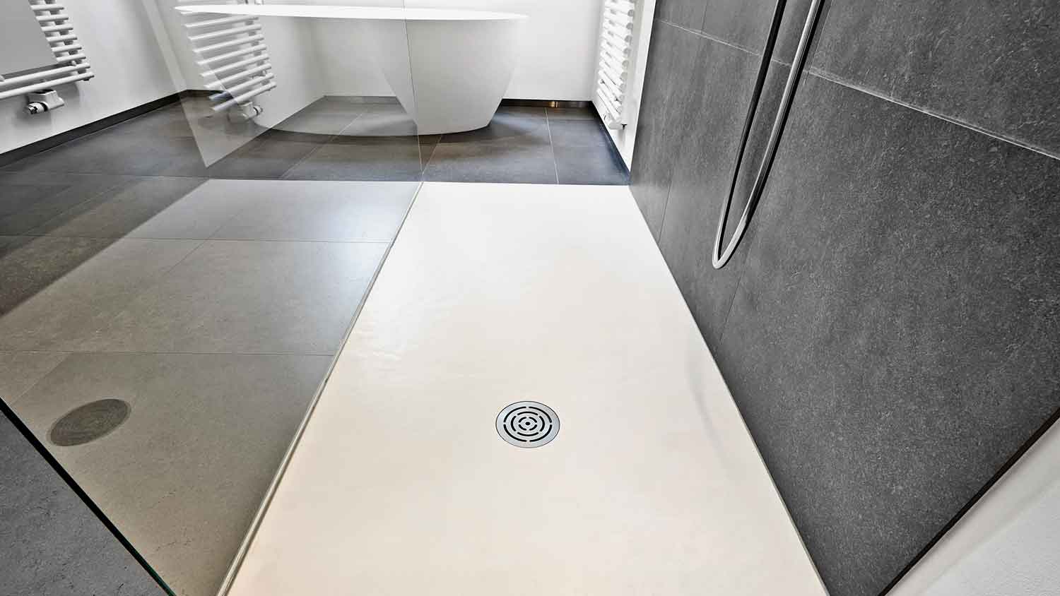 Point drain installed in a minimalist shower