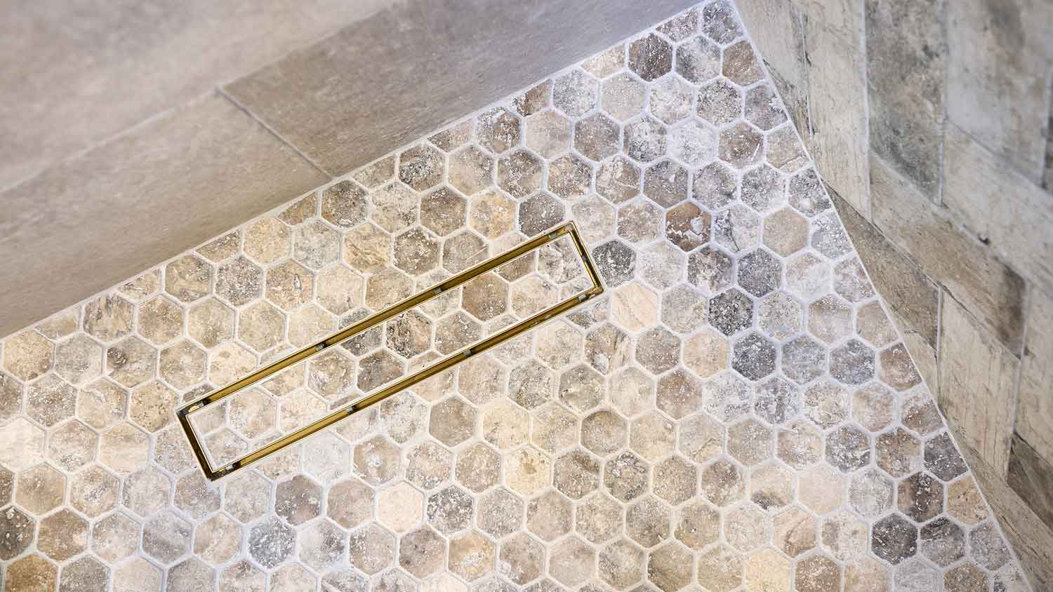 Shower linear drain covered with tile