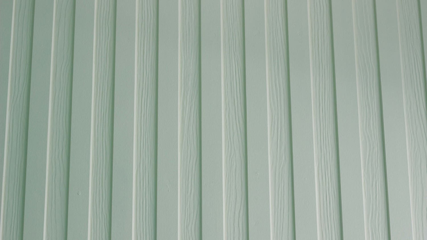 Textured board and batten siding