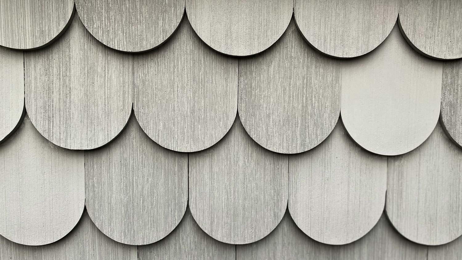 Gray scalloped shingle siding.