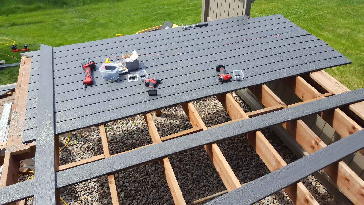A partially constructed PVC deck