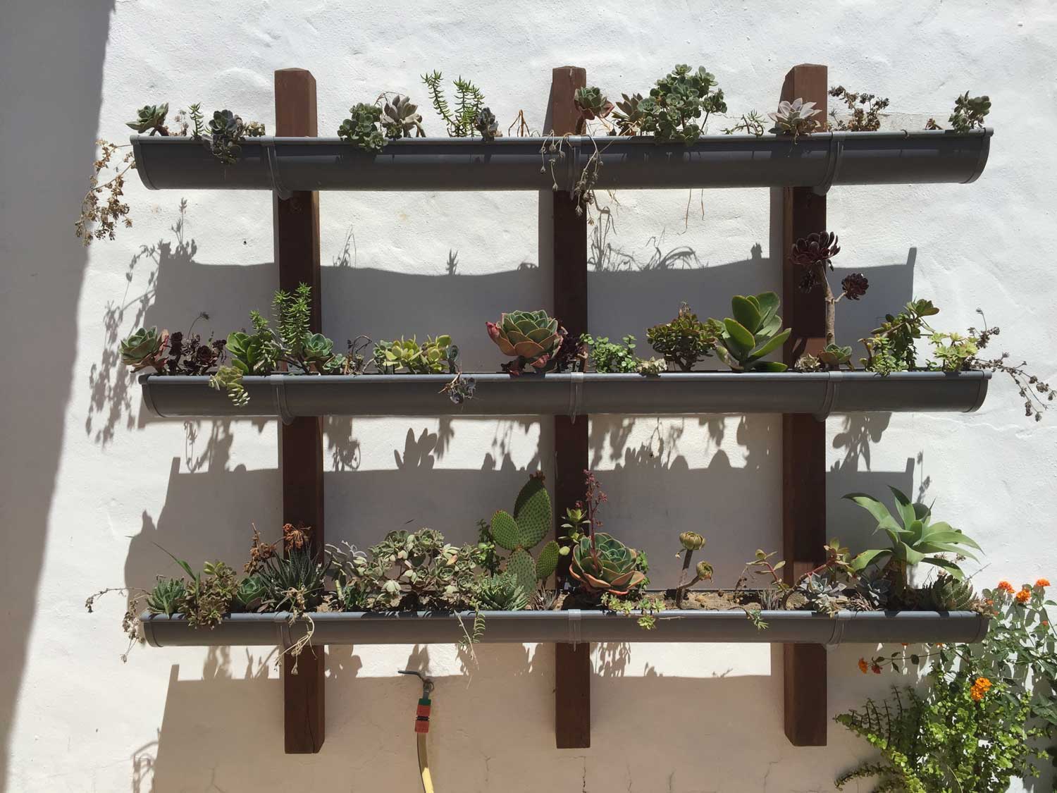 A stacked vertical wall planter