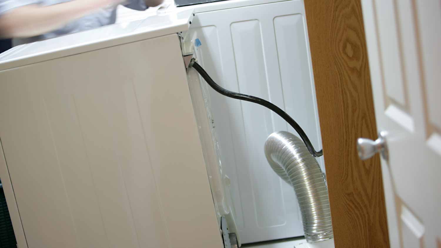 Worker installing dryer machine