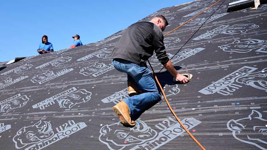 Men prepping roof for singles. 