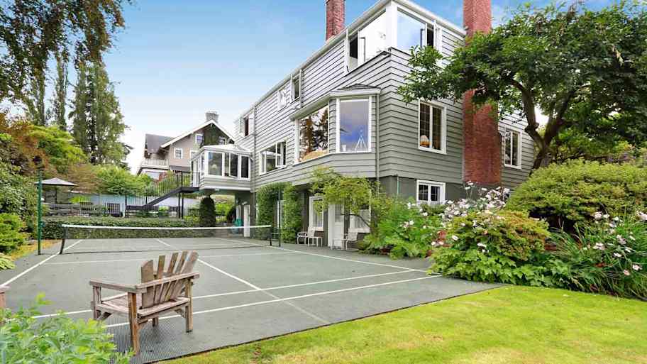 luxury home with outdoor tennis court