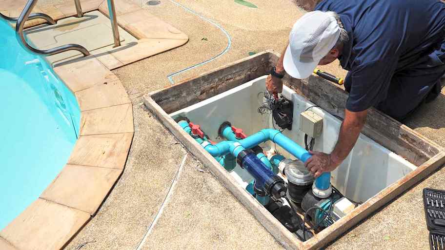 Electrician repairing swimming pool pump