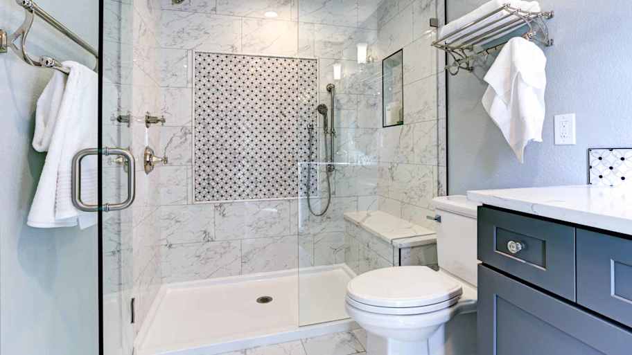 A bathroom with acrylic shower pan