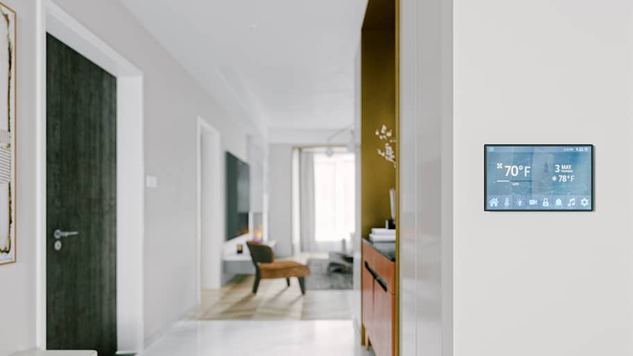 digital smart thermostat on wall at home