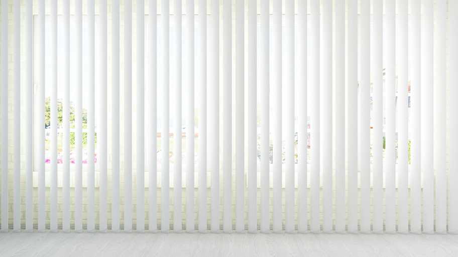 Room with white vertical blinds
