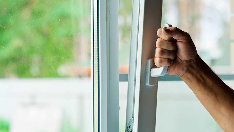 Person opening a window