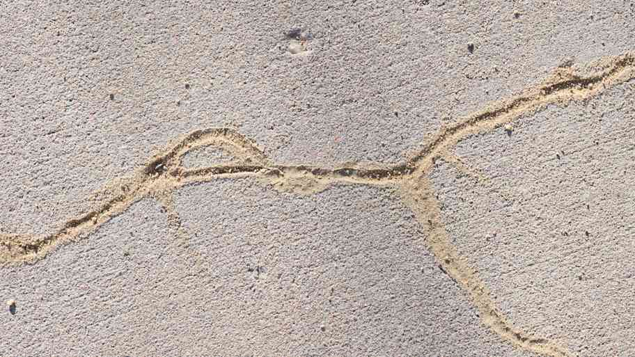 Detail of cracks in concrete.