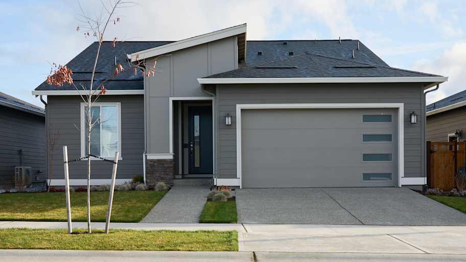 Curb view of modern house.
