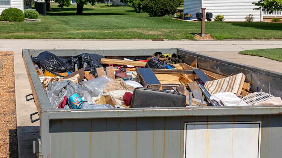 dumpster full of household junk