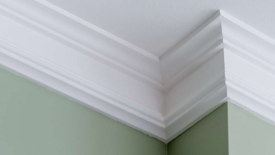 A crown molding in an intricate corner of the ceiling 