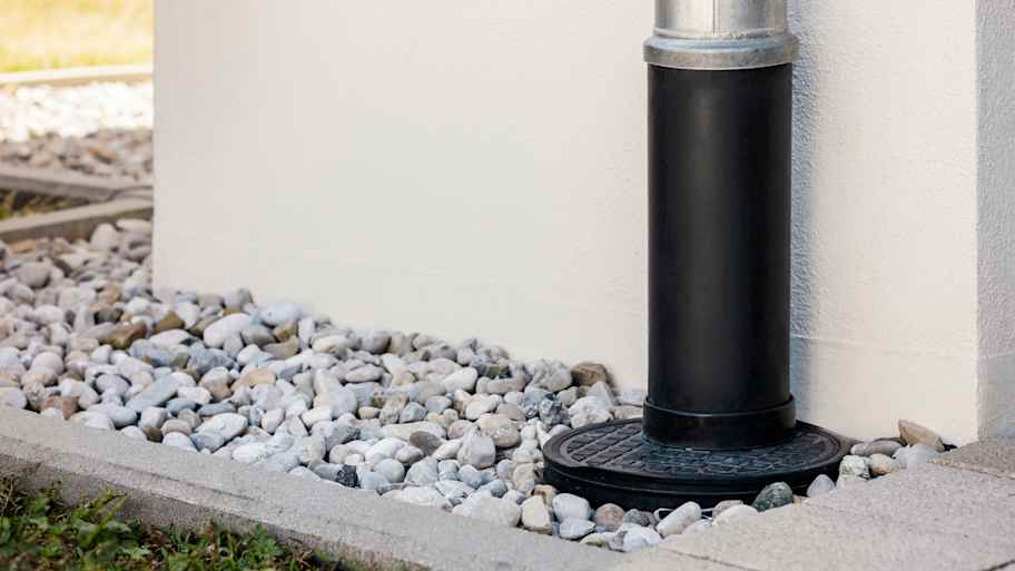 Gutter downspout and a French drain installed in the yard