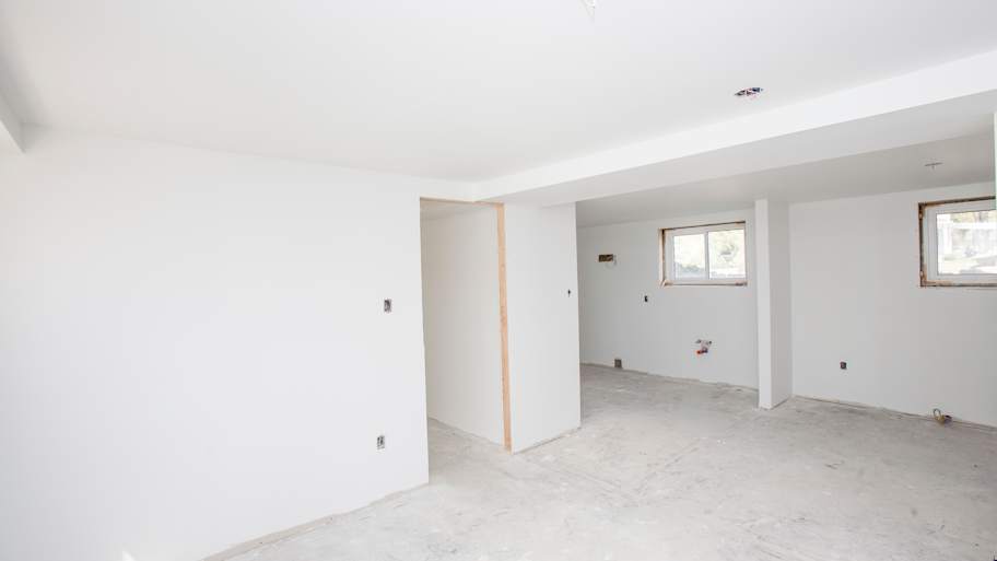 A large basement with drywalls
