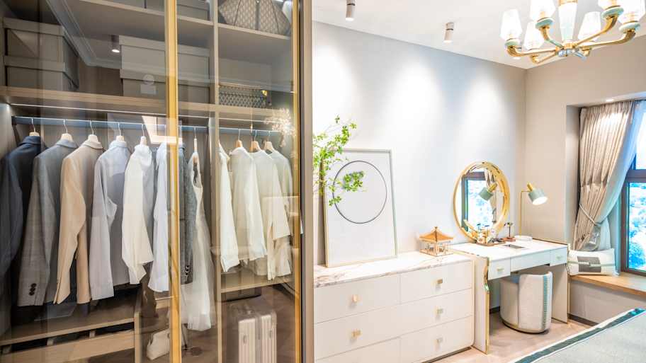 A reach-in closet with transparent doors