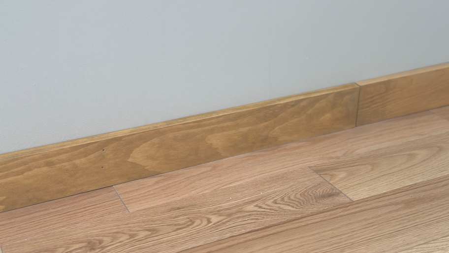 Close up of pine baseboard