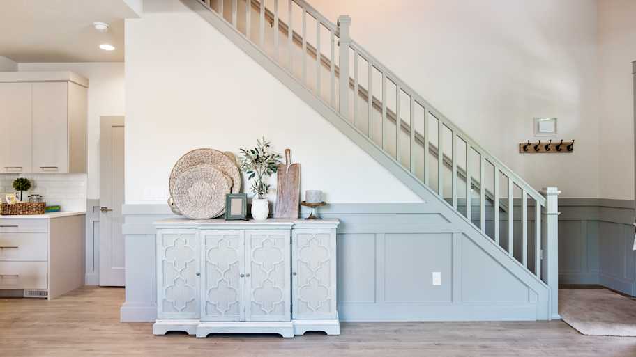 Gray paneling and railing on stairway