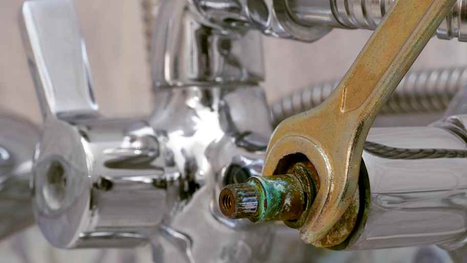 Close-up of a shower cartridge being replaced