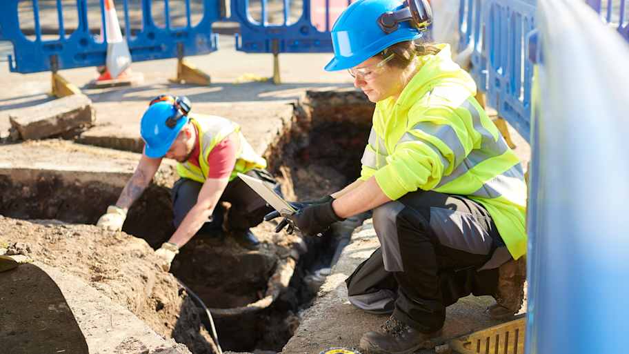 Inspector supervising a new excavation in the city 