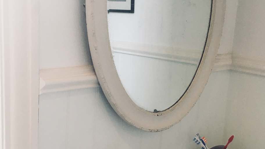 Mirror with sink and toothbrushes