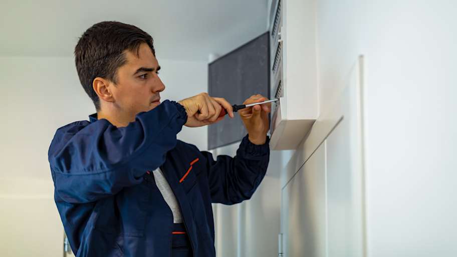man replacing electrical box