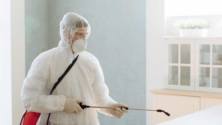 A professional performing rat control