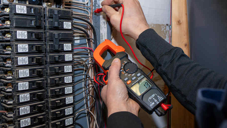 Inspector testing circuit breaker 