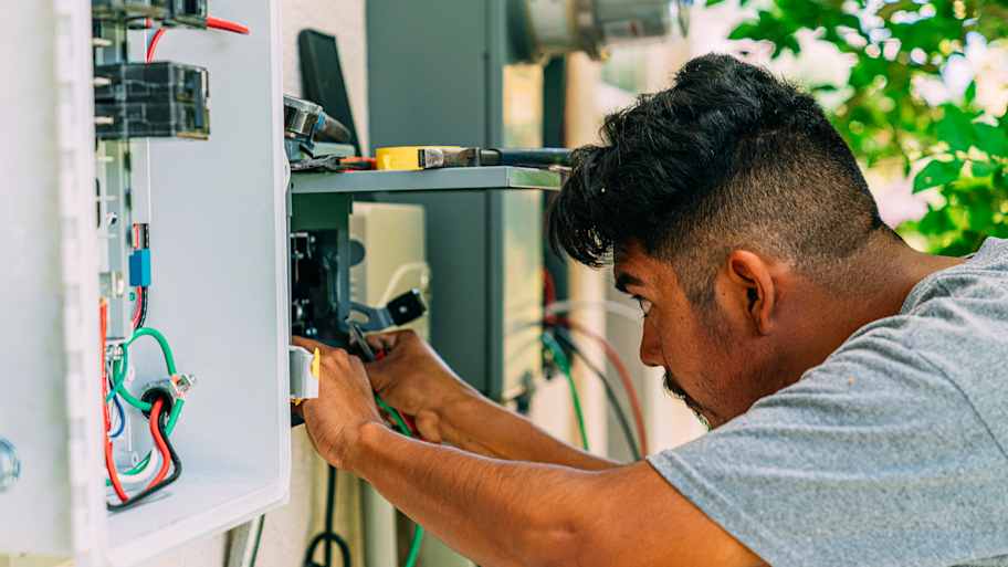 Man checking electrical box   