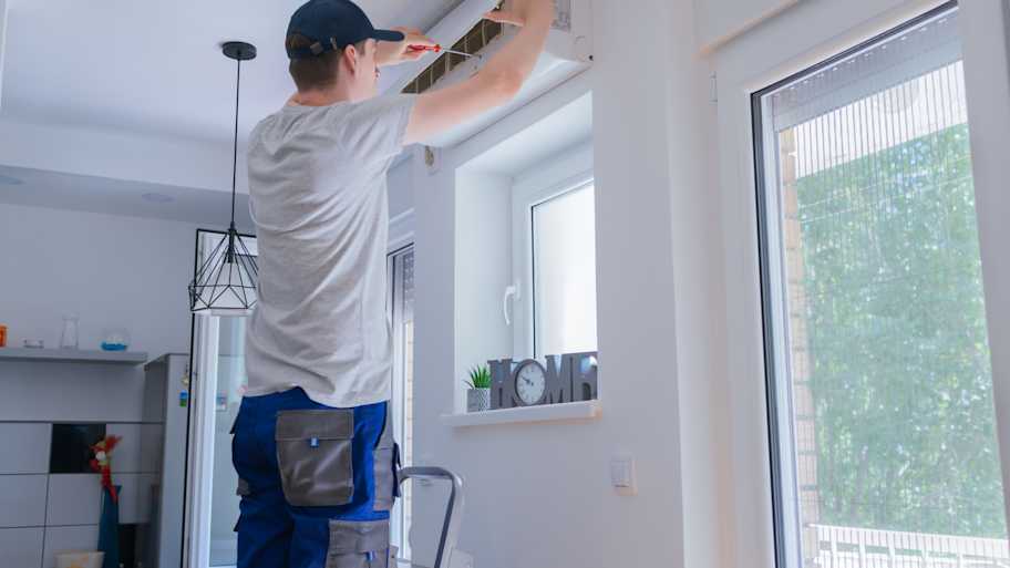 technician repairing ac