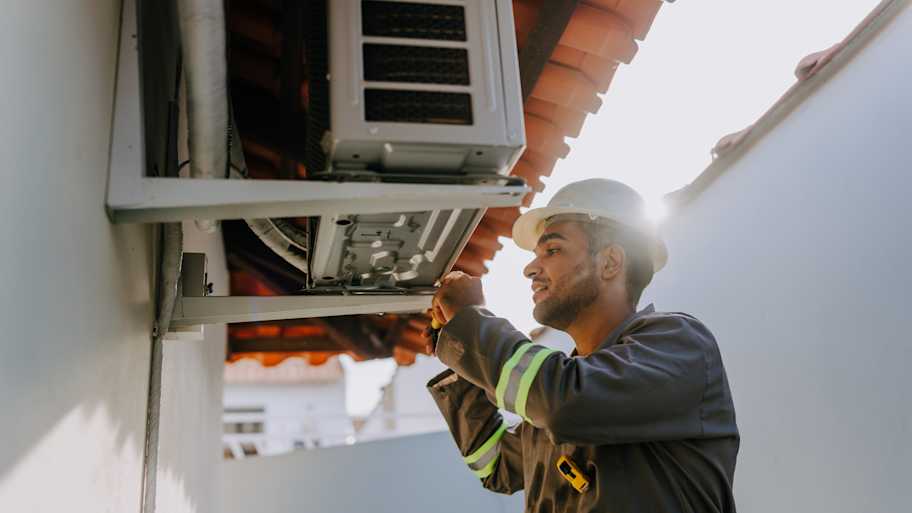 technician checking ac unit