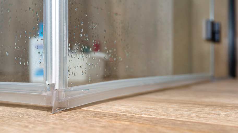 Seals in the lower part of the thresholdless shower enclosure, visible door corner